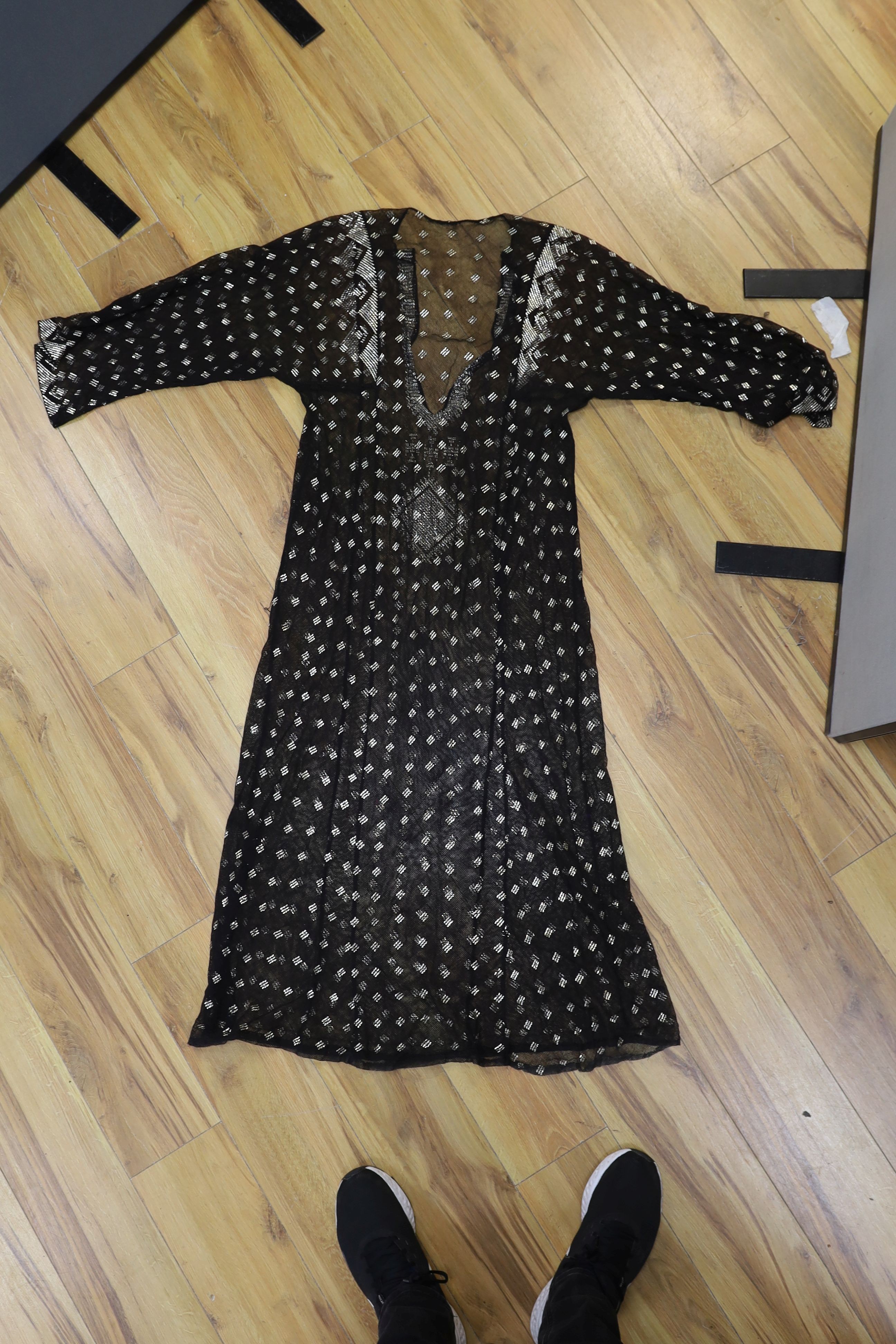 A dress made from a metal and black net Egyptian shawl; a similar shawl and a piece of shawl